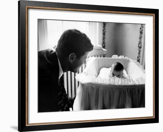 Sen. John F. Kennedy Playing Peek-A-Boo with His Daughter Caroline in Her Crib-Ed Clark-Framed Photographic Print