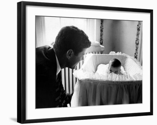 Sen. John F. Kennedy Playing Peek-A-Boo with His Daughter Caroline in Her Crib-Ed Clark-Framed Photographic Print