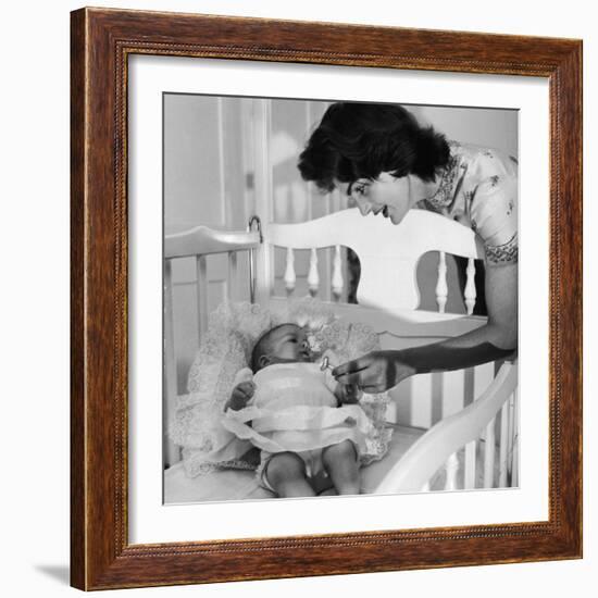 Sen. John Kennedy's Wife Jacqueline Offering Baby Caroline a Silver Rattle at their Georgetown Home-Nina Leen-Framed Premium Photographic Print
