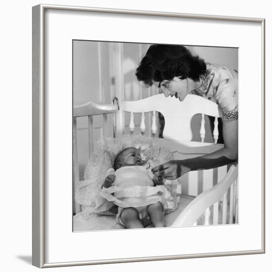 Sen. John Kennedy's Wife Jacqueline Offering Baby Caroline a Silver Rattle at their Georgetown Home-Nina Leen-Framed Premium Photographic Print