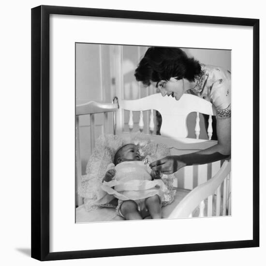 Sen. John Kennedy's Wife Jacqueline Offering Baby Caroline a Silver Rattle at their Georgetown Home-Nina Leen-Framed Premium Photographic Print