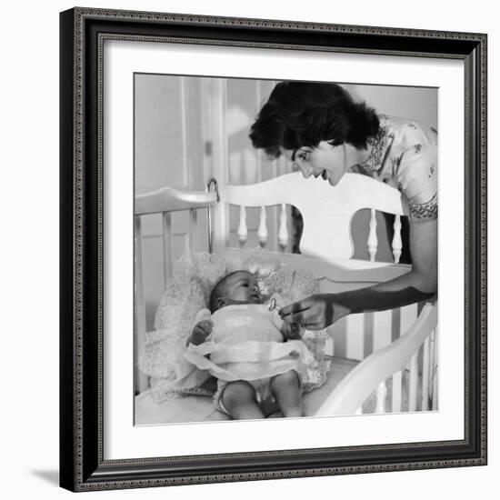 Sen. John Kennedy's Wife Jacqueline Offering Baby Caroline a Silver Rattle at their Georgetown Home-Nina Leen-Framed Premium Photographic Print