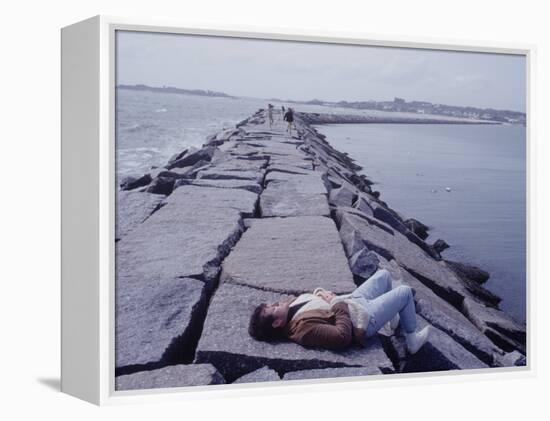 Senator Edward M. Kennedy Basking in Sun on Breakwater in Hyannis Port-John Loengard-Framed Premier Image Canvas