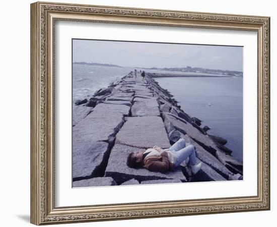 Senator Edward M. Kennedy Basking in Sun on Breakwater in Hyannis Port-John Loengard-Framed Photographic Print