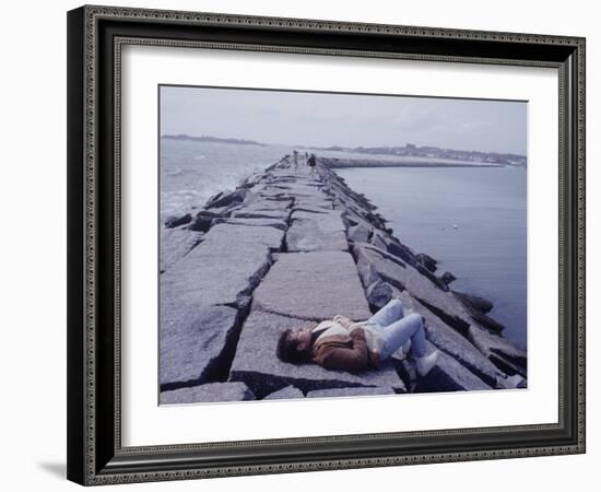 Senator Edward M. Kennedy Basking in Sun on Breakwater in Hyannis Port-John Loengard-Framed Photographic Print