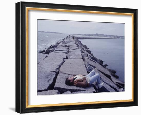 Senator Edward M. Kennedy Basking in Sun on Breakwater in Hyannis Port-John Loengard-Framed Photographic Print