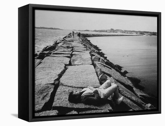 Senator Edward M. Kennedy Taking a Sunbath on Breakwater Near His Summer Home-John Loengard-Framed Premier Image Canvas