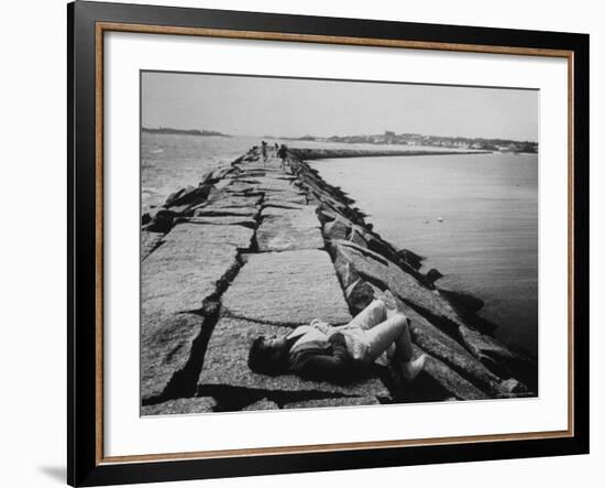 Senator Edward M. Kennedy Taking a Sunbath on Breakwater Near His Summer Home-John Loengard-Framed Photographic Print