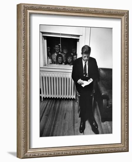 Senator John F. Kennedy Checking over Speech During His Presidential Campaign-Paul Schutzer-Framed Photographic Print