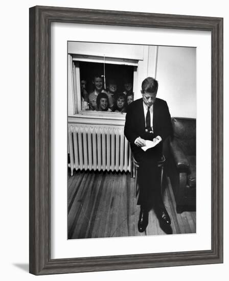 Senator John F. Kennedy Checking over Speech During His Presidential Campaign-Paul Schutzer-Framed Photographic Print