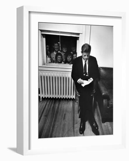 Senator John F. Kennedy Checking over Speech During His Presidential Campaign-Paul Schutzer-Framed Photographic Print