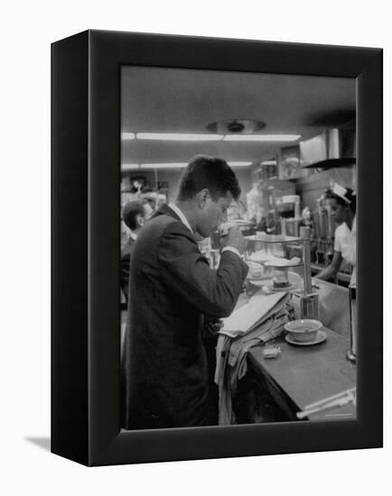 Senator John F. Kennedy Drinking a Cup of Coffee at a Cafe in Washington Airport-Ed Clark-Framed Premier Image Canvas