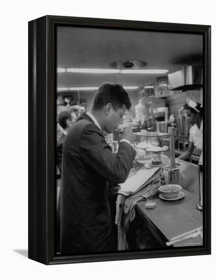 Senator John F. Kennedy Drinking a Cup of Coffee at a Cafe in Washington Airport-Ed Clark-Framed Premier Image Canvas