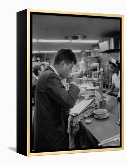 Senator John F. Kennedy Drinking a Cup of Coffee at a Cafe in Washington Airport-Ed Clark-Framed Premier Image Canvas