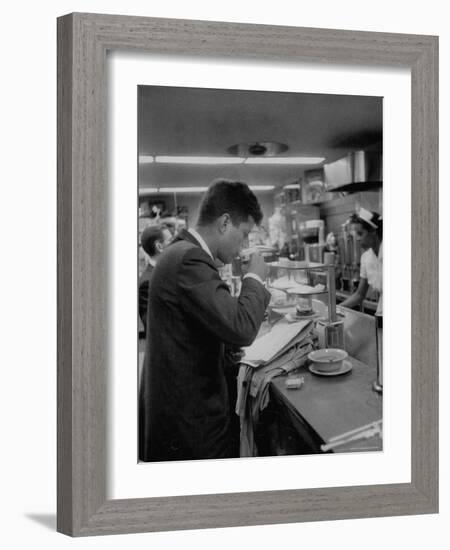 Senator John F. Kennedy Drinking a Cup of Coffee at a Cafe in Washington Airport-Ed Clark-Framed Photographic Print