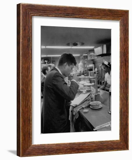 Senator John F. Kennedy Drinking a Cup of Coffee at a Cafe in Washington Airport-Ed Clark-Framed Photographic Print