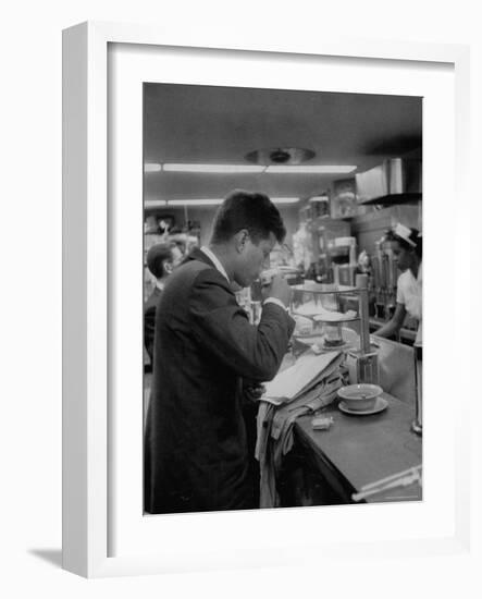 Senator John F. Kennedy Drinking a Cup of Coffee at a Cafe in Washington Airport-Ed Clark-Framed Photographic Print