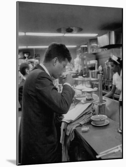 Senator John F. Kennedy Drinking a Cup of Coffee at a Cafe in Washington Airport-Ed Clark-Mounted Photographic Print