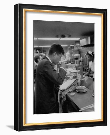 Senator John F. Kennedy Drinking a Cup of Coffee at a Cafe in Washington Airport-Ed Clark-Framed Photographic Print