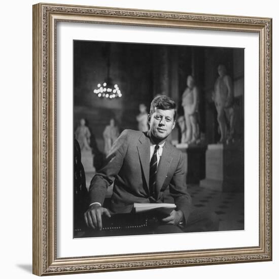 Senator John F. Kennedy Seated in Museum W. Statues-null-Framed Photographic Print