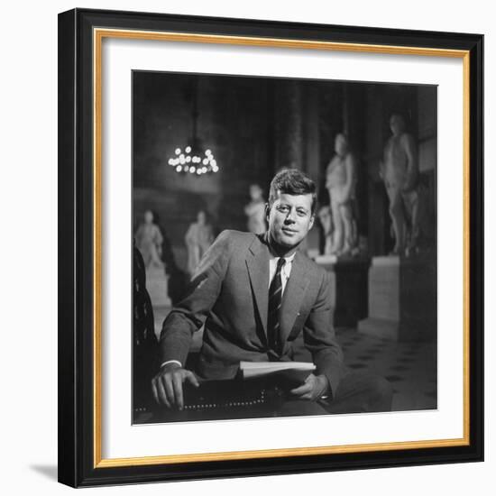 Senator John F. Kennedy Seated in Museum W. Statues-null-Framed Photographic Print