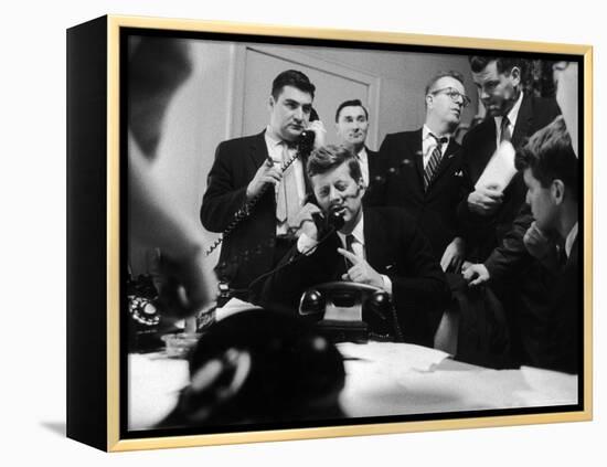 Senator John F. Kennedy Talking on the Phone Surrounded by Aides During the Primary Elections-Stan Wayman-Framed Premier Image Canvas