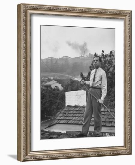 Senator Richard M. Nixon on Roof of Home in Los Angeles, Putting Out Fires Caused by Brush Blaze-Allan Grant-Framed Photographic Print