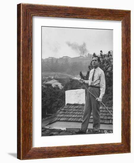 Senator Richard M. Nixon on Roof of Home in Los Angeles, Putting Out Fires Caused by Brush Blaze-Allan Grant-Framed Photographic Print