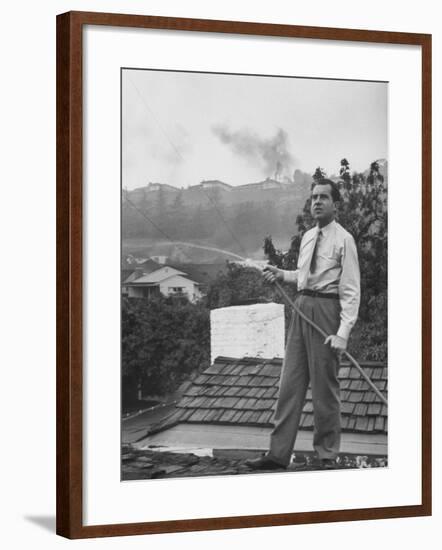 Senator Richard M. Nixon on Roof of Home in Los Angeles, Putting Out Fires Caused by Brush Blaze-Allan Grant-Framed Photographic Print