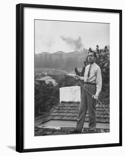 Senator Richard M. Nixon on Roof of Home in Los Angeles, Putting Out Fires Caused by Brush Blaze-Allan Grant-Framed Photographic Print