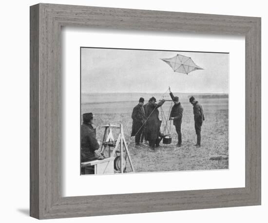 'Sending up one of the French war kites, to which a camera is attached', 1914, (1915)-Unknown-Framed Photographic Print