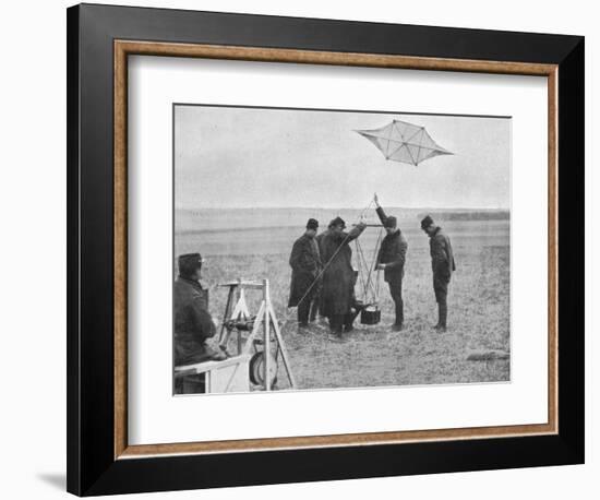 'Sending up one of the French war kites, to which a camera is attached', 1914, (1915)-Unknown-Framed Photographic Print