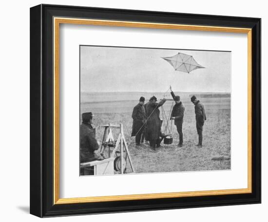'Sending up one of the French war kites, to which a camera is attached', 1914, (1915)-Unknown-Framed Photographic Print
