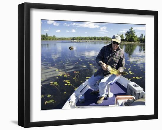 Senior Man Holding a Fish-null-Framed Photographic Print