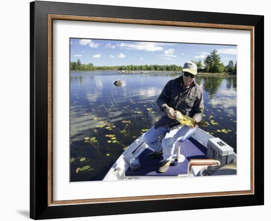 Senior Man Holding a Fish-null-Framed Photographic Print