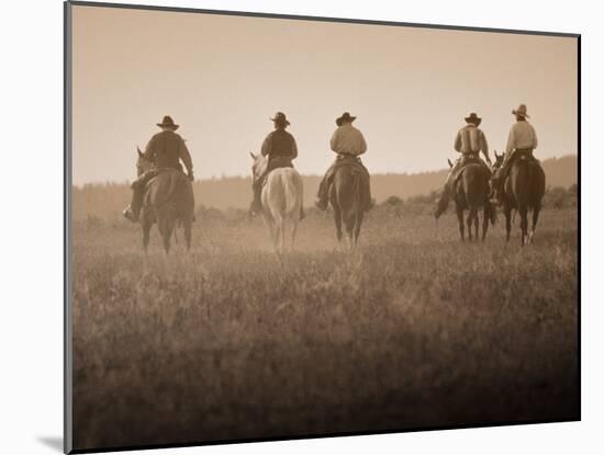 Sepia Effect of Cowboys Riding, Seneca, Oregon, USA-Nancy & Steve Ross-Mounted Photographic Print