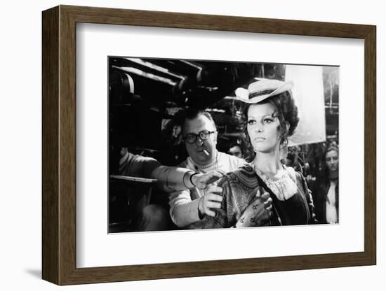 Sergio Leone (1929 - 1989) and Claudia Cardinale during the shooting of Once Upon a Time in the Wes-null-Framed Photo