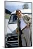 Serie televisee Columbo with Peter Falk (inspecteur Columbo), 1971-93 (devant sa voiture Peugeot 40-null-Mounted Photo