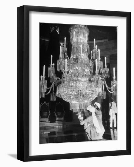 Servants of British Lord Archibald Wavell cleaning Crystal Chandelier in Opulent Palace-Margaret Bourke-White-Framed Photographic Print