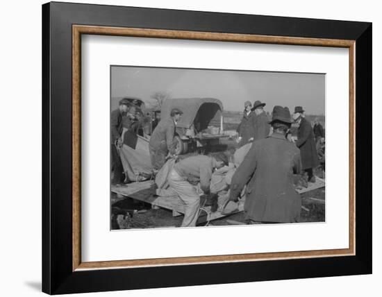 Setting up a tent in the camp for white flood refugees at Forrest City, Arkansas, 1937-Walker Evans-Framed Photographic Print