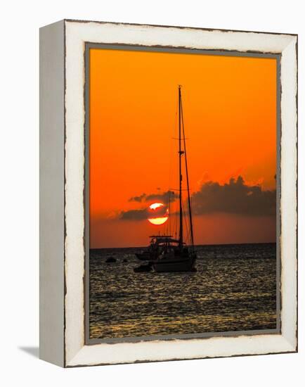 Seven Mile Beach, Grand Cayman. Sailboat on the Carribean at sunset.-Jolly Sienda-Framed Premier Image Canvas