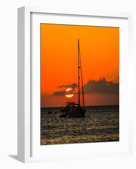 Seven Mile Beach, Grand Cayman. Sailboat on the Carribean at sunset.-Jolly Sienda-Framed Photographic Print