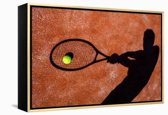 Shadow Of A Tennis Player In Action On A Tennis Court (Conceptual Image With A Tennis Ball-l i g h t p o e t-Framed Stretched Canvas