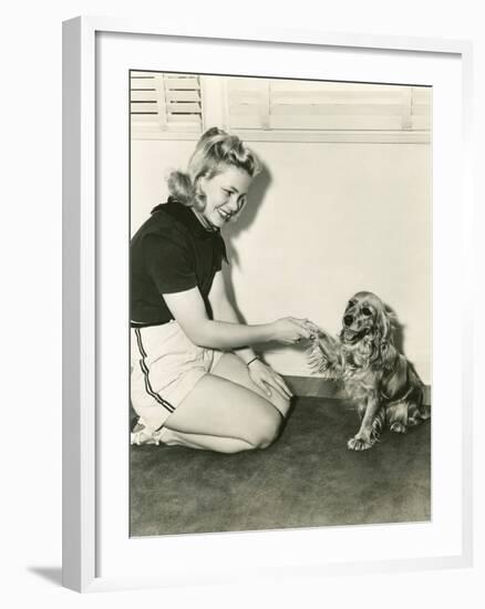 Shaking Hands with Her Cocker Spaniel-null-Framed Photo