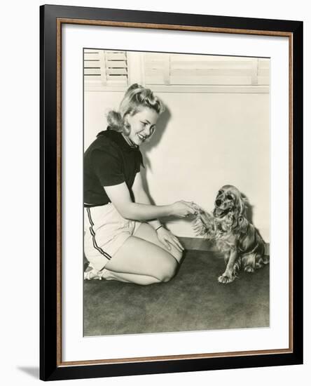 Shaking Hands with Her Cocker Spaniel-null-Framed Photo