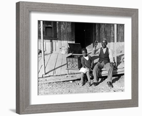 Sharecropper, Lonnie Fair and Daughter Listen to Victrola on Farm in Mississippi-Alfred Eisenstaedt-Framed Photographic Print