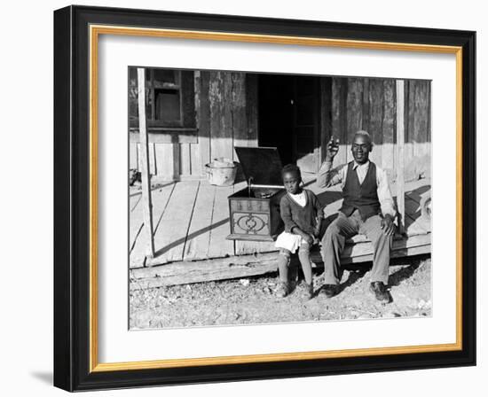 Sharecropper, Lonnie Fair and Daughter Listen to Victrola on Farm in Mississippi-Alfred Eisenstaedt-Framed Photographic Print