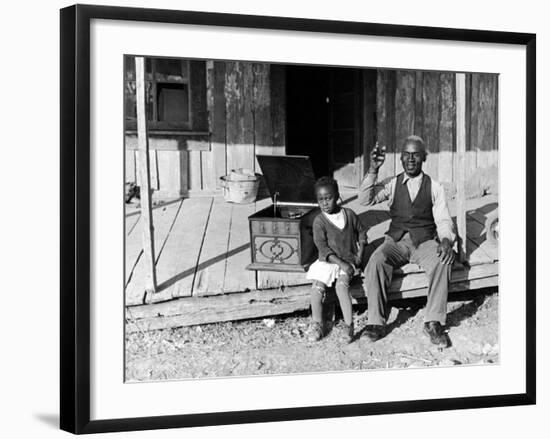 Sharecropper, Lonnie Fair and Daughter Listen to Victrola on Farm in Mississippi-Alfred Eisenstaedt-Framed Photographic Print