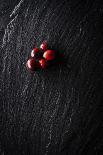 Five Cranberries Clustered In One Spot On Slate Background With Plenty Of Negative Space For Copy-Shea Evans-Photographic Print