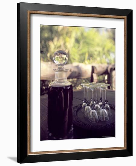 Sherry Bottle and Glasses at Jao Camp, Botswana-Stuart Westmoreland-Framed Photographic Print